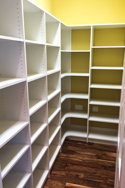 Large walk-in pantry with radius shelves in San Marco